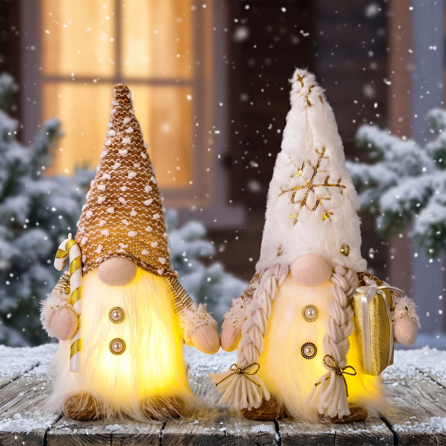 Light-up gnomes with gold sequin and white knit hats in the snow