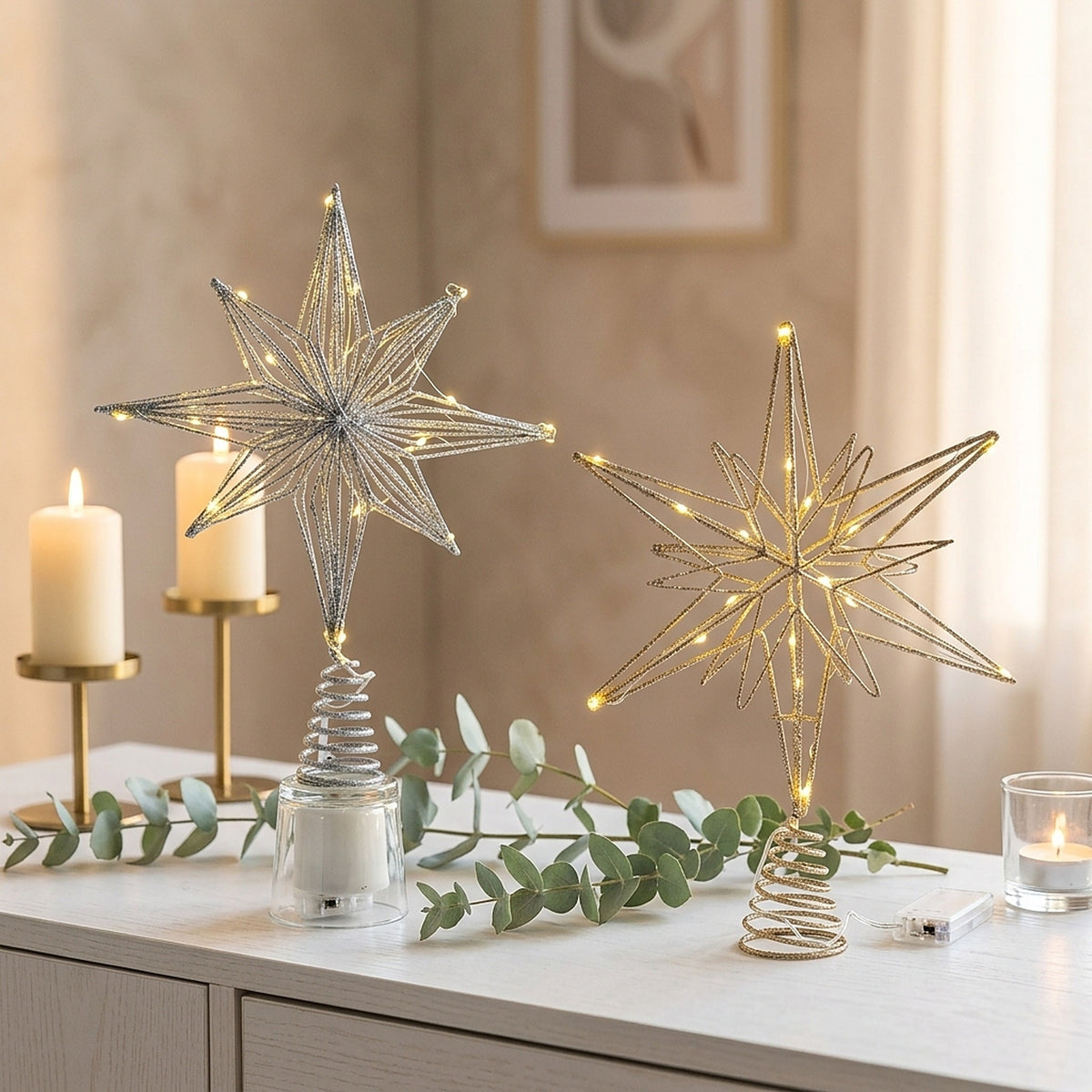 Silver and gold 8-point light-up star tree toppers on a mantel