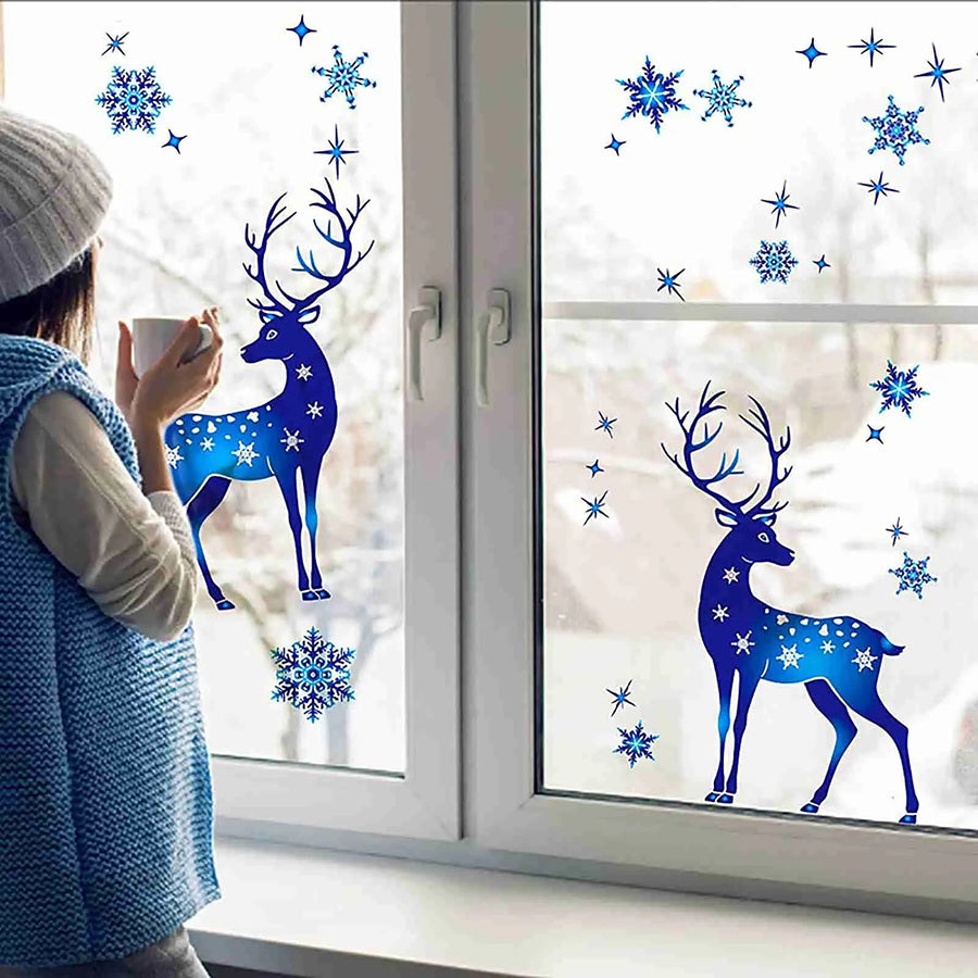 Blue reindeer and snowflake window clings on a window