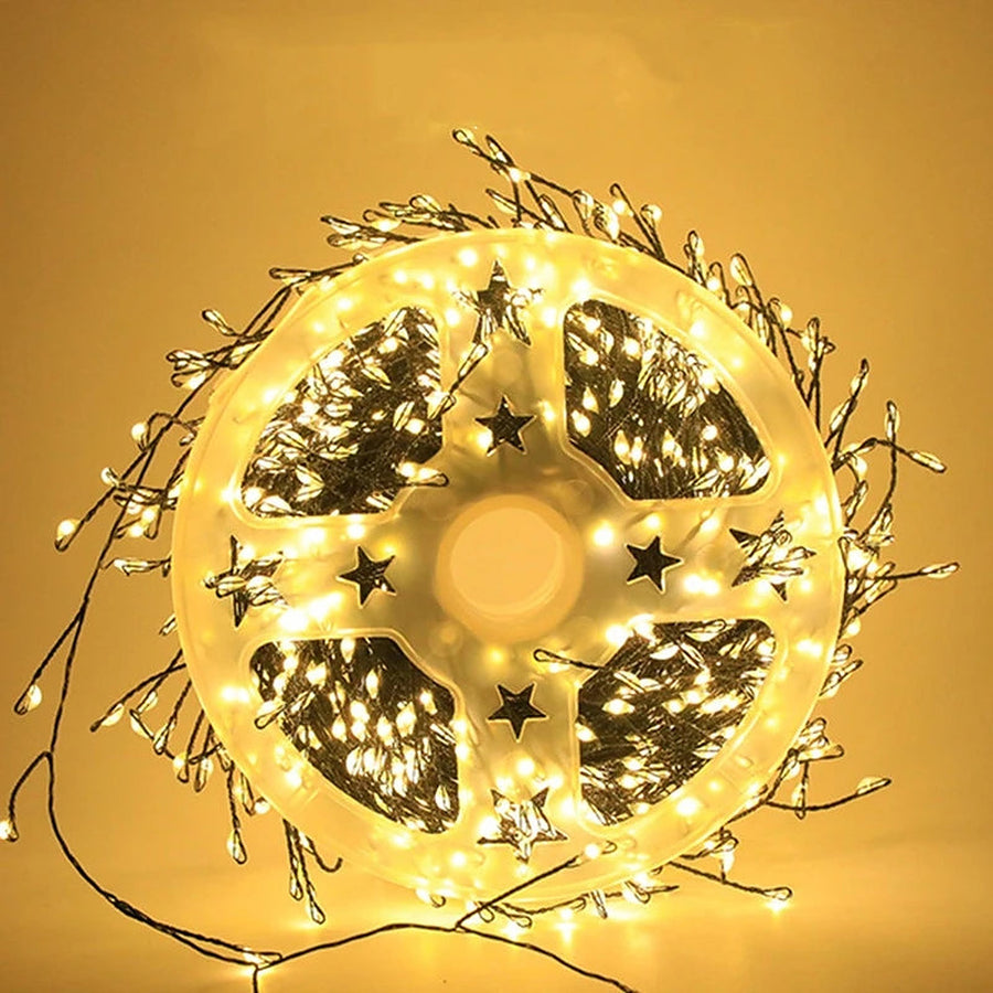 Warm white firecracker cluster lights on a storage reel