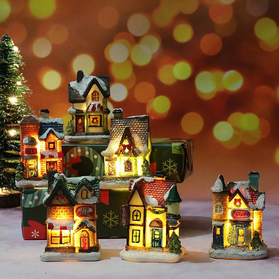 Collection of glowing miniature Christmas village houses