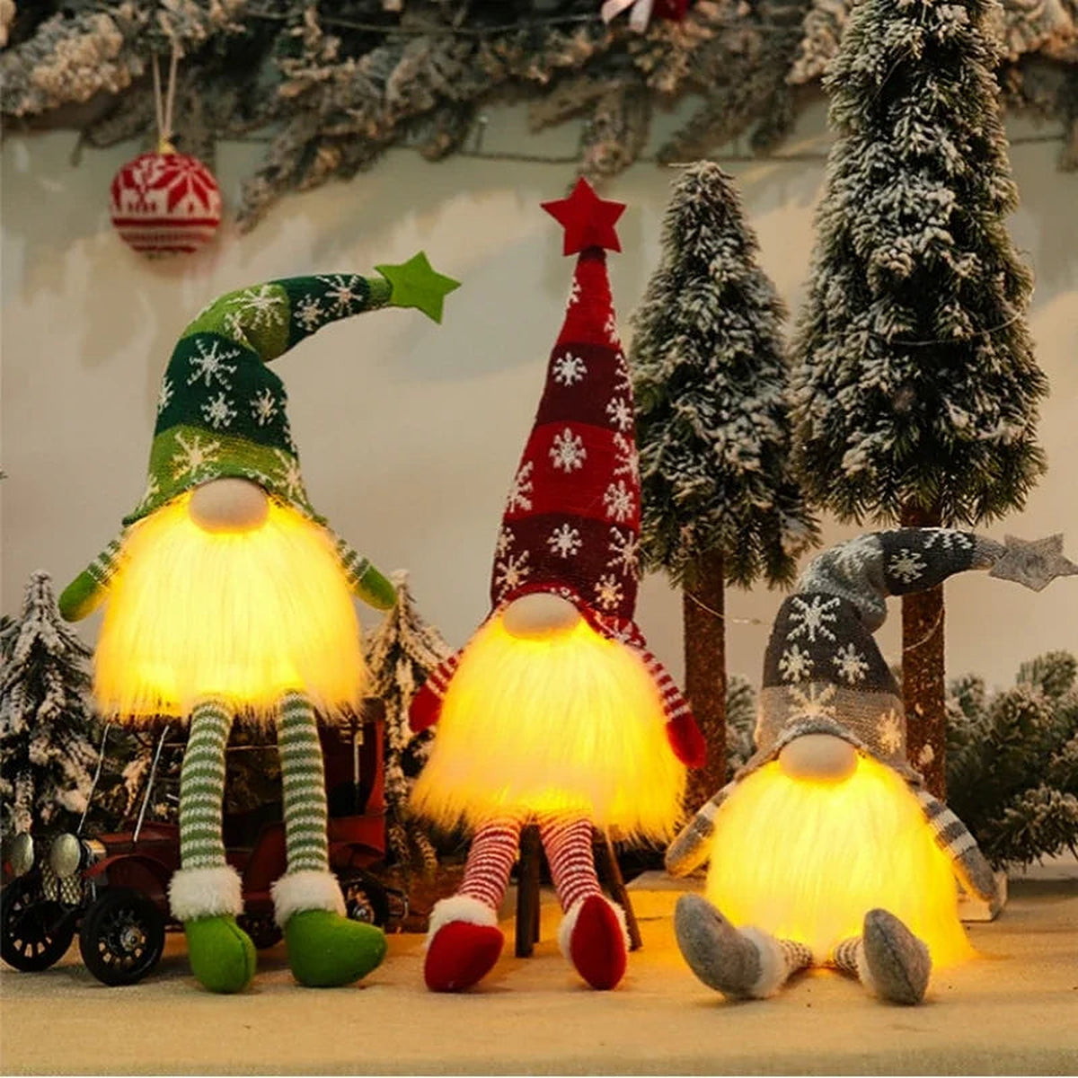 Three glowing gnomes with green, red and grey knit hats