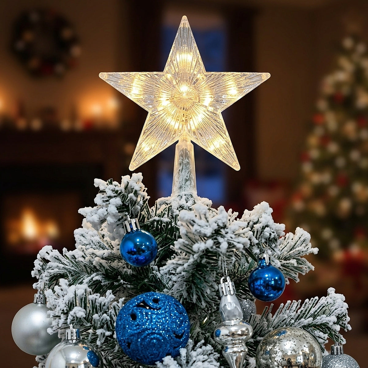 Warm white LED star topper on a snowy Christmas tree