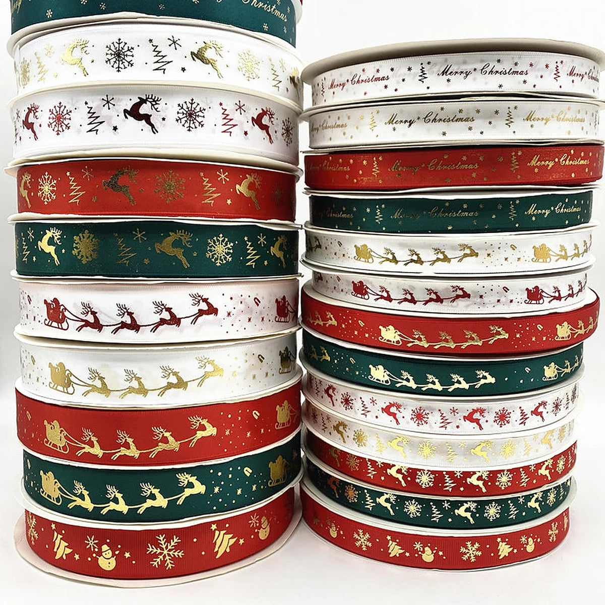 Stacked rolls of red, white and green Christmas ribbon