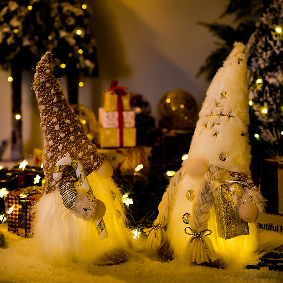 Glowing gnome dolls with sequin and knit hats beside gifts