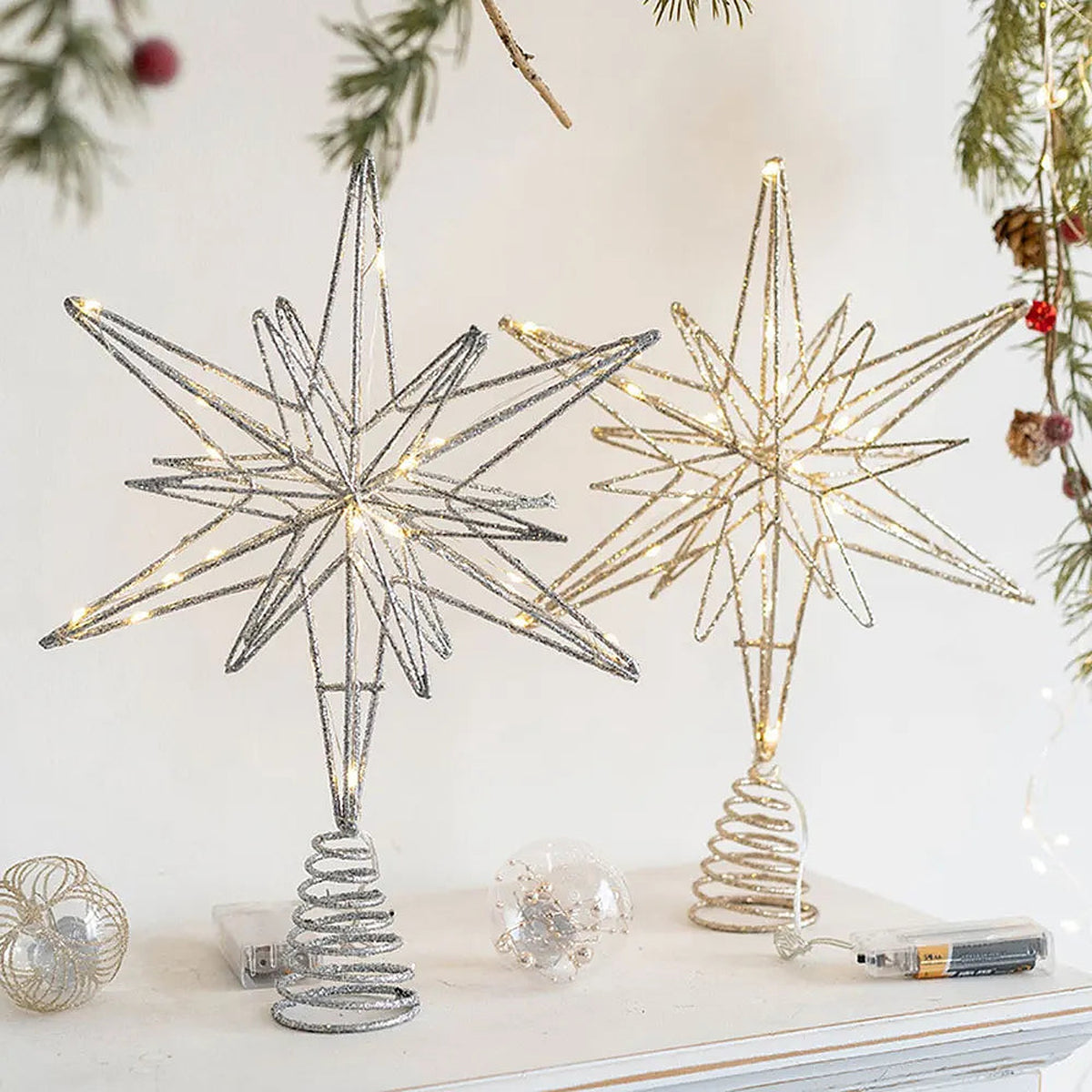 Silver and gold 8-point wire star toppers with spiral bases