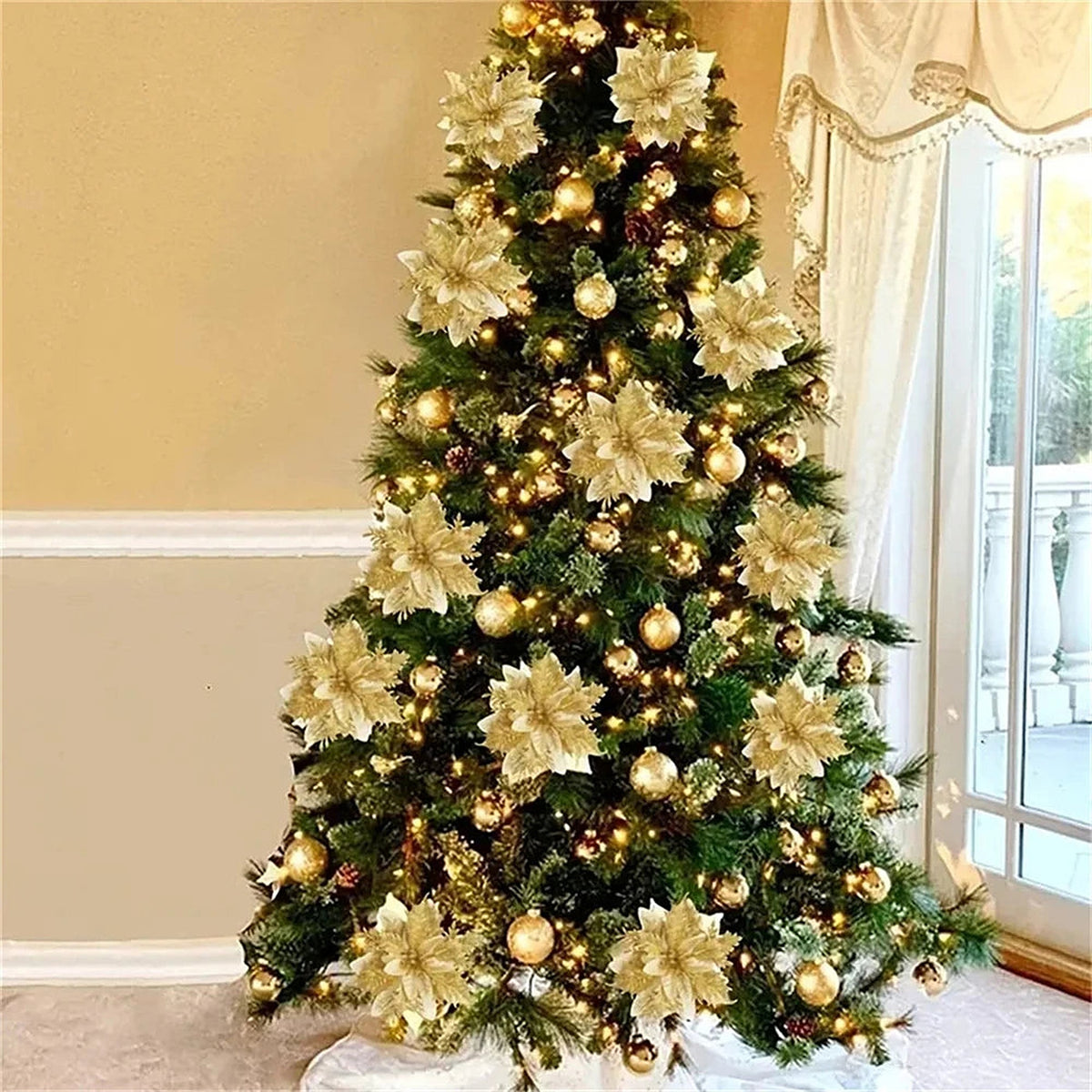 Christmas tree filled with gold glitter poinsettia flowers