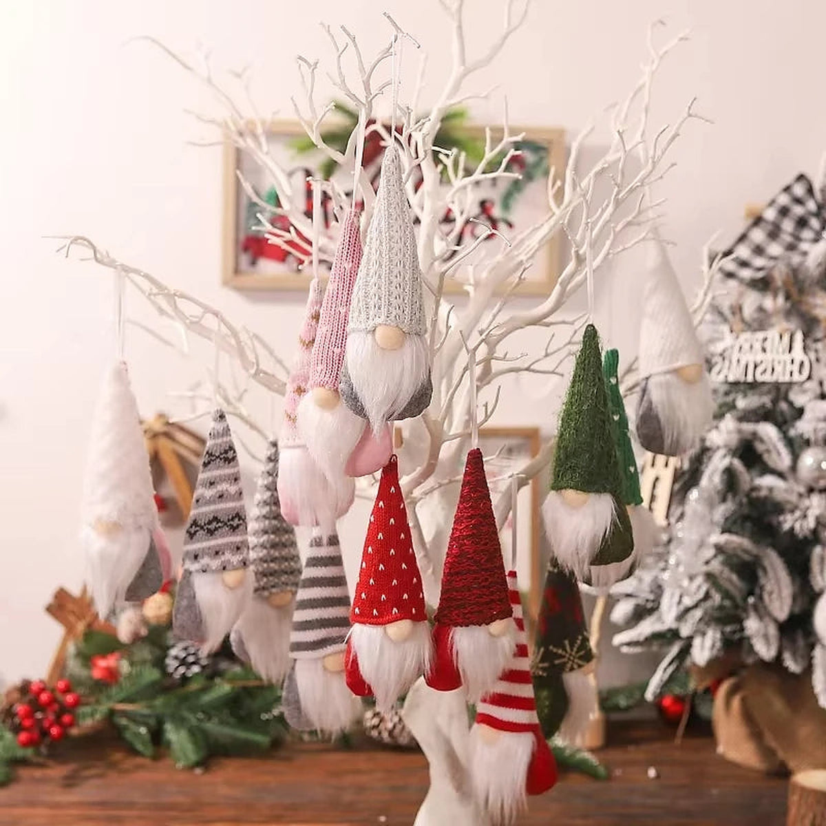 Plush gnome ornaments hanging on white branches