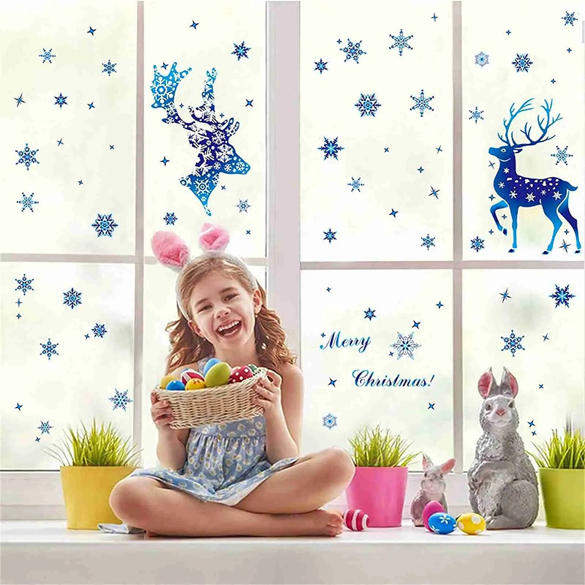 Reindeer and snowflake window clings on a window