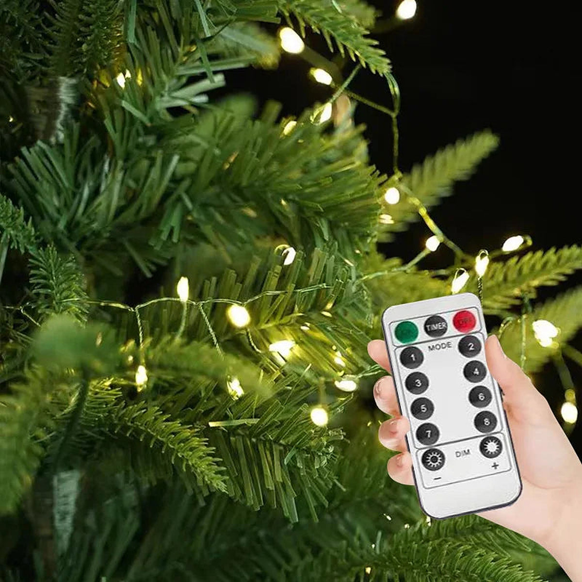 Remote control with cluster lights on a Christmas tree