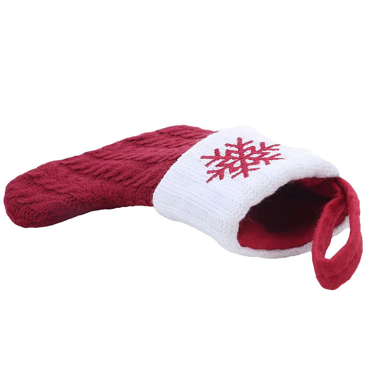 Snowflake mini knit stocking lying on its side