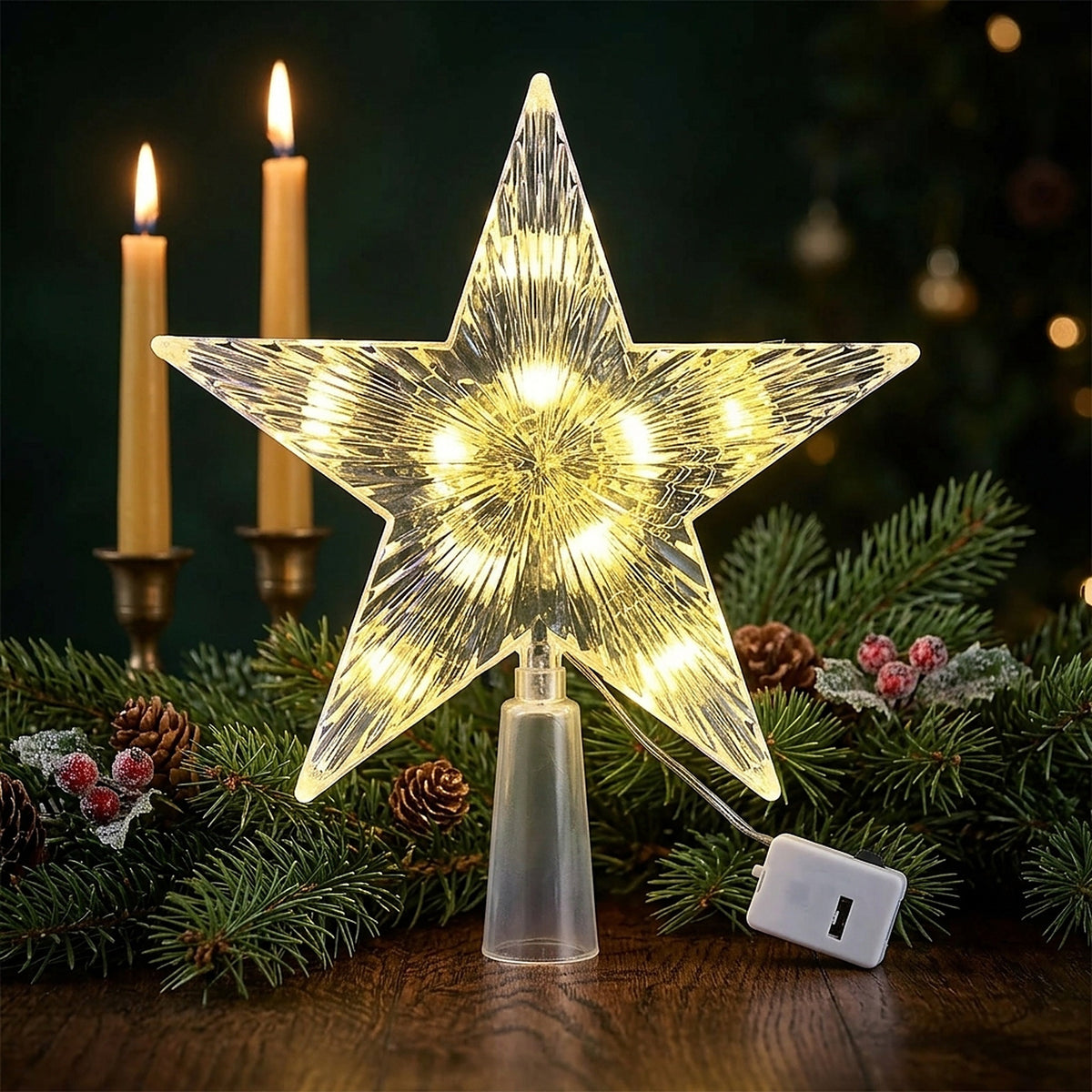 Clear star tree topper lit with warm white LEDs beside candles