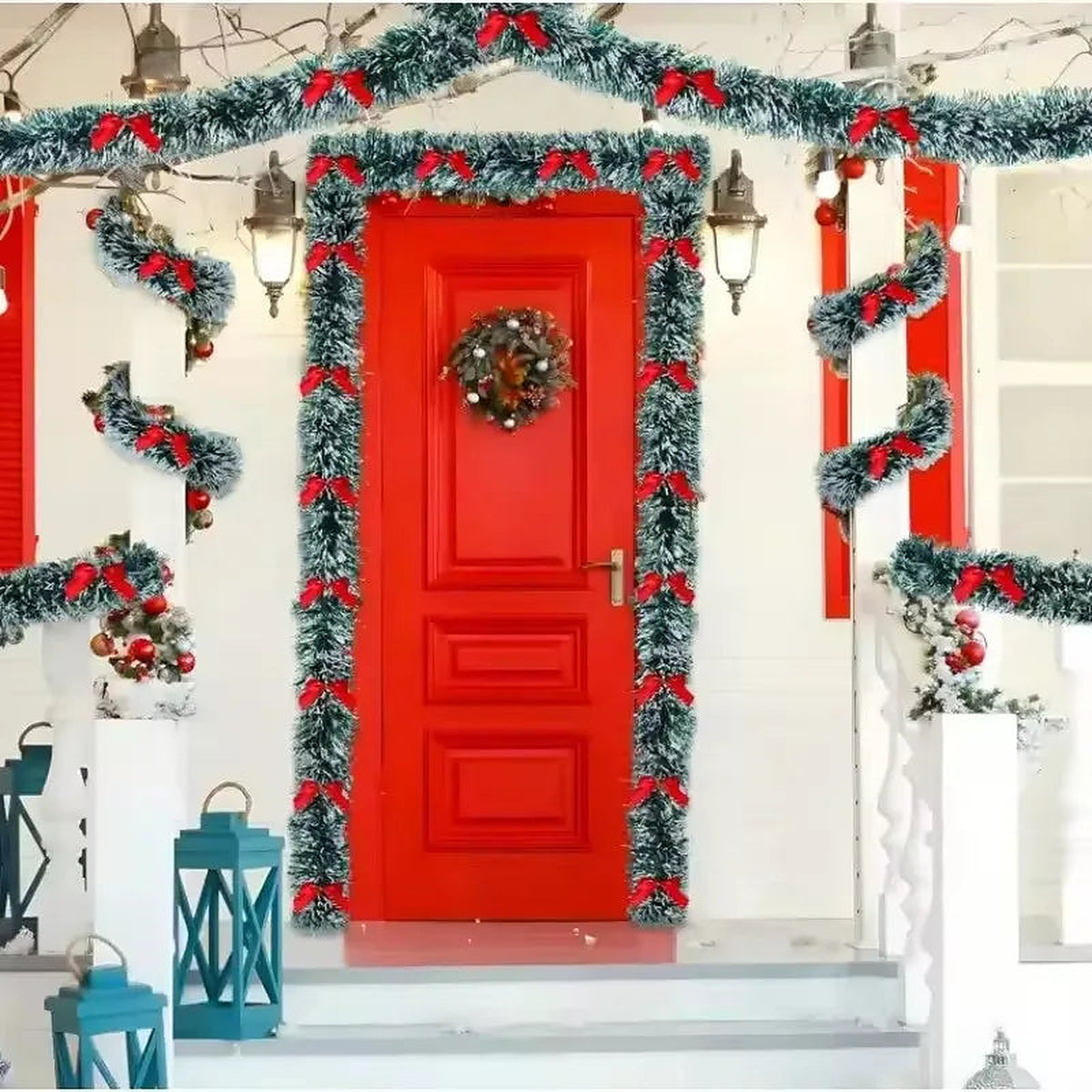 Tinsel garland with red bows framing a red front door