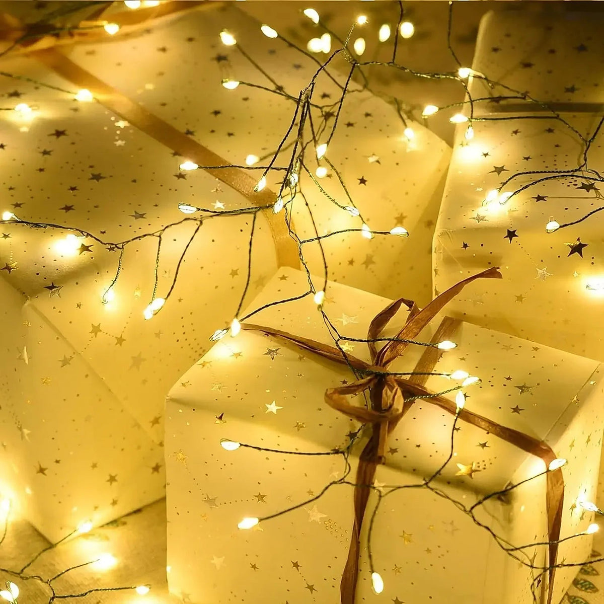 Cluster lights draped over wrapped gifts