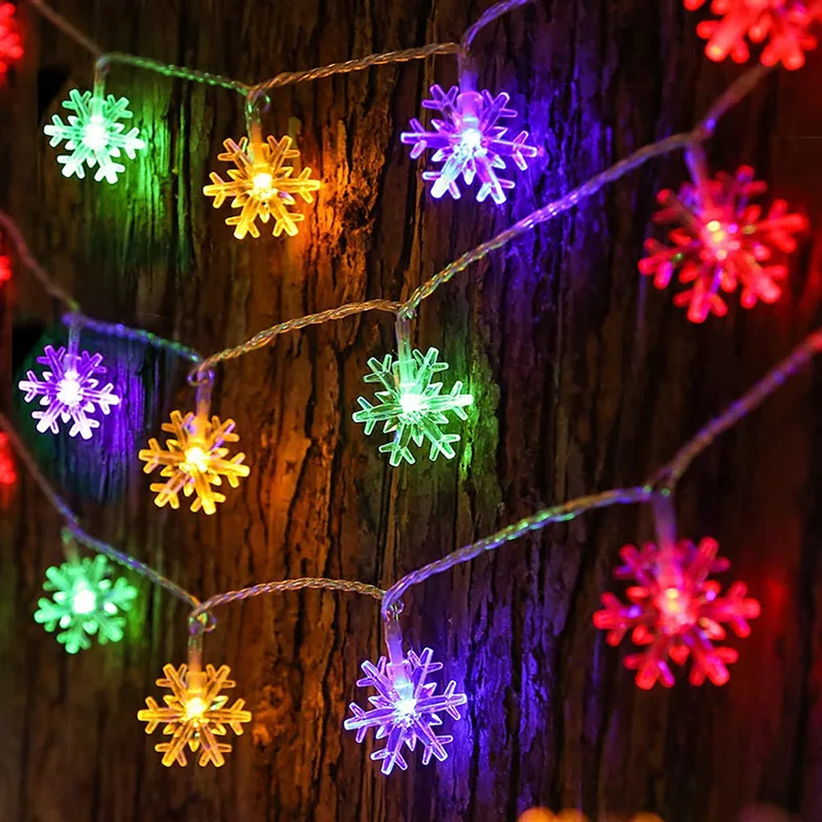 Multicolor LED snowflake string lights glowing