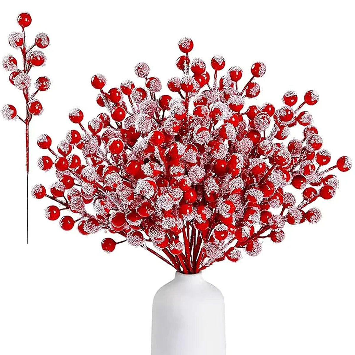 Frosted red berry picks in a white vase