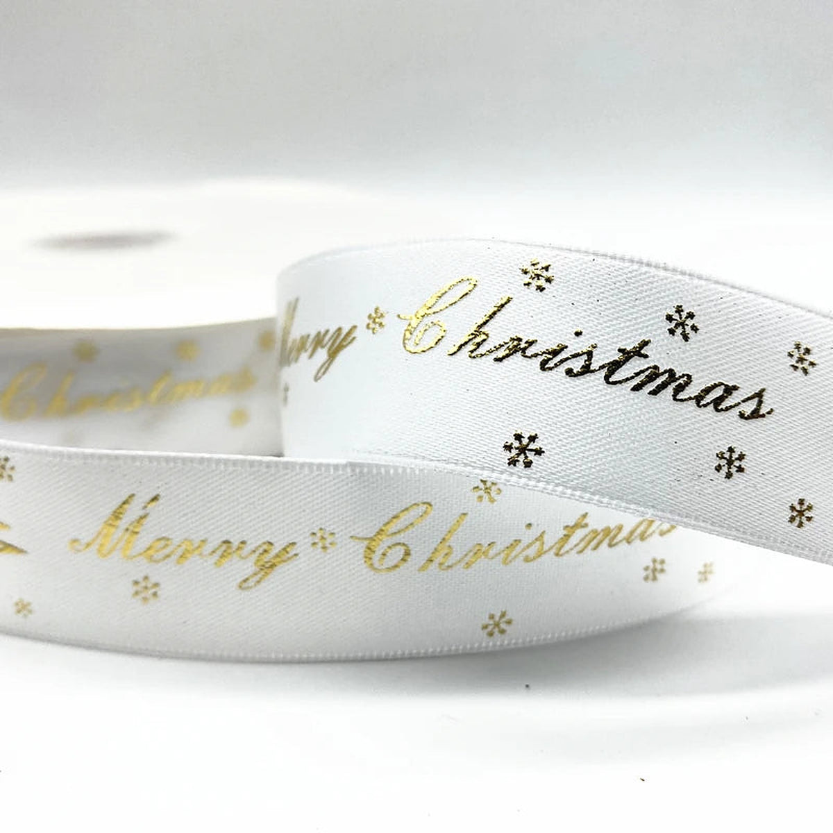 White ribbon with gold Merry Christmas script