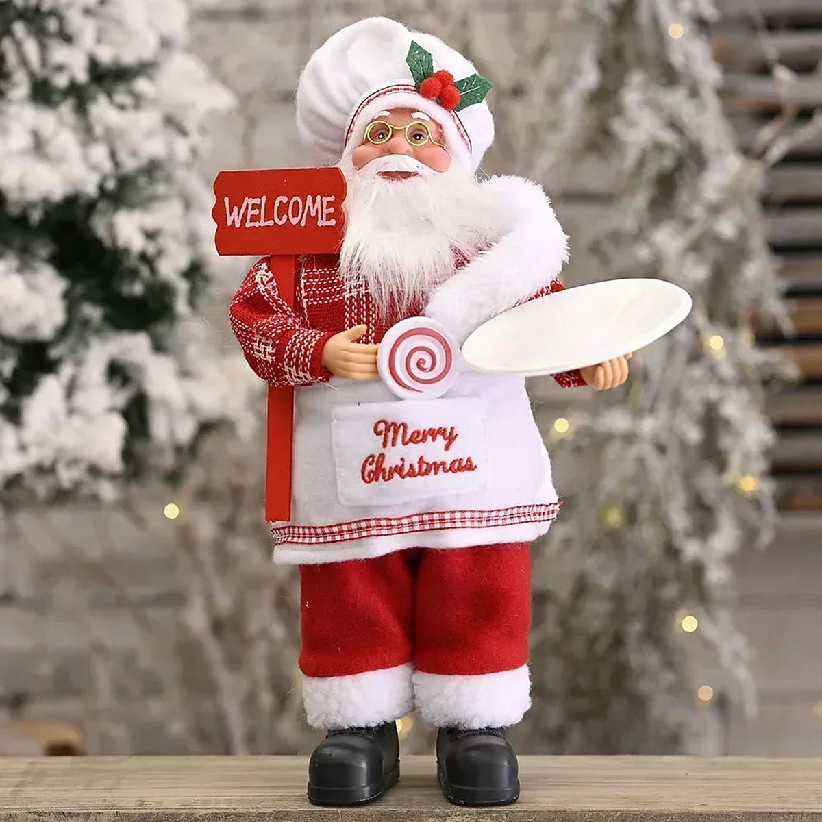 Chef Santa figure with Welcome sign and Merry Christmas apron