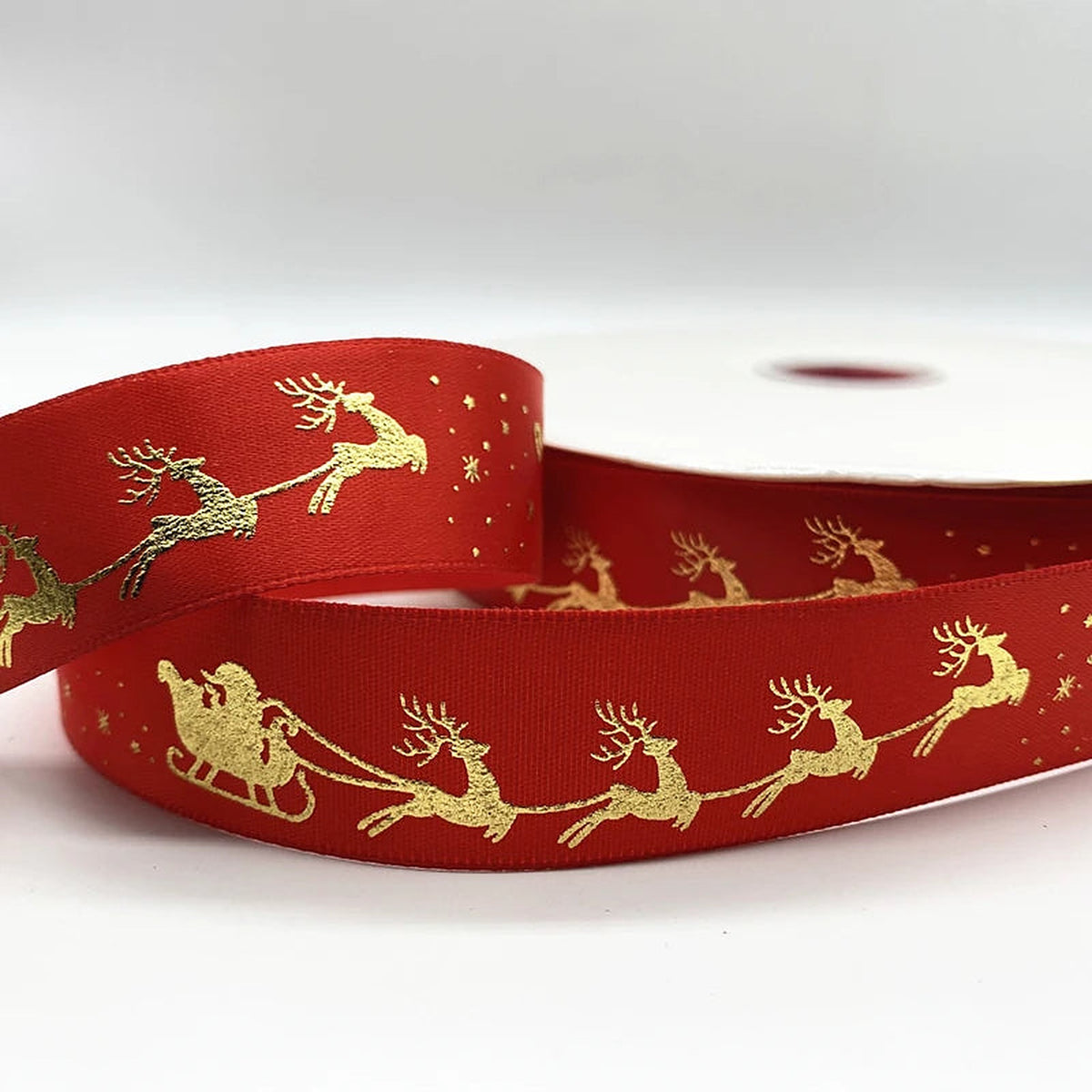 Red ribbon with gold sleigh and reindeer