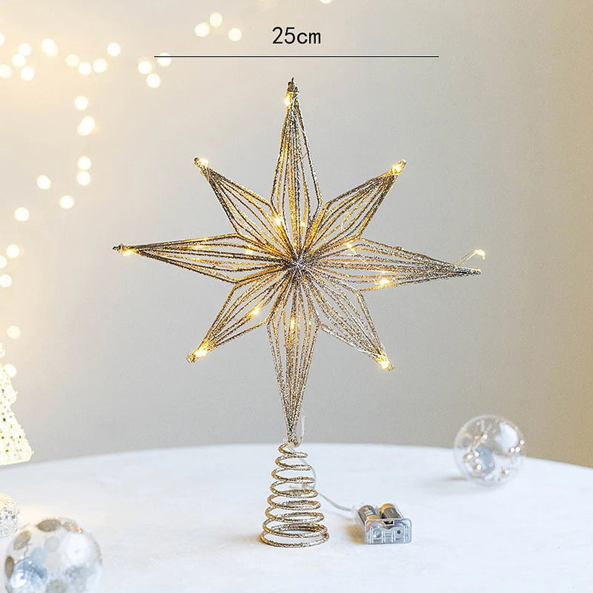 Gold light-up 8-point star tree topper, 25 cm wide