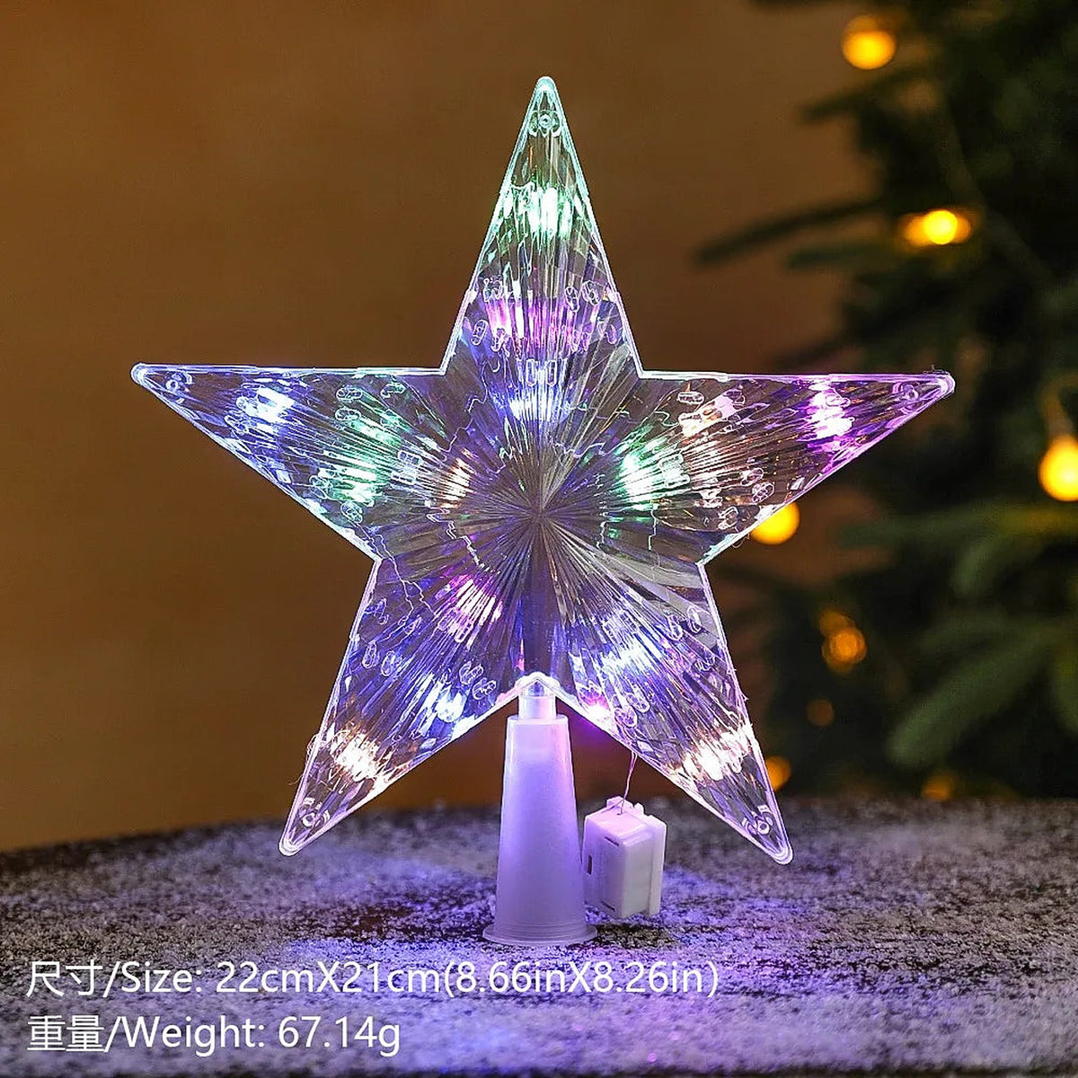 Clear star tree topper with purple and blue lights
