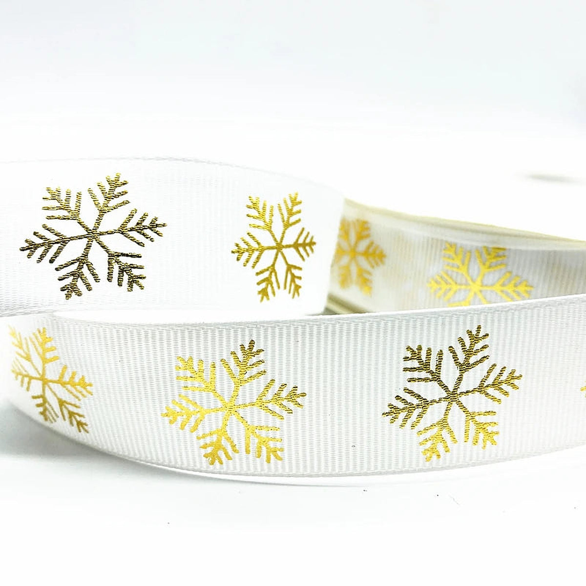 White grosgrain ribbon with gold snowflakes