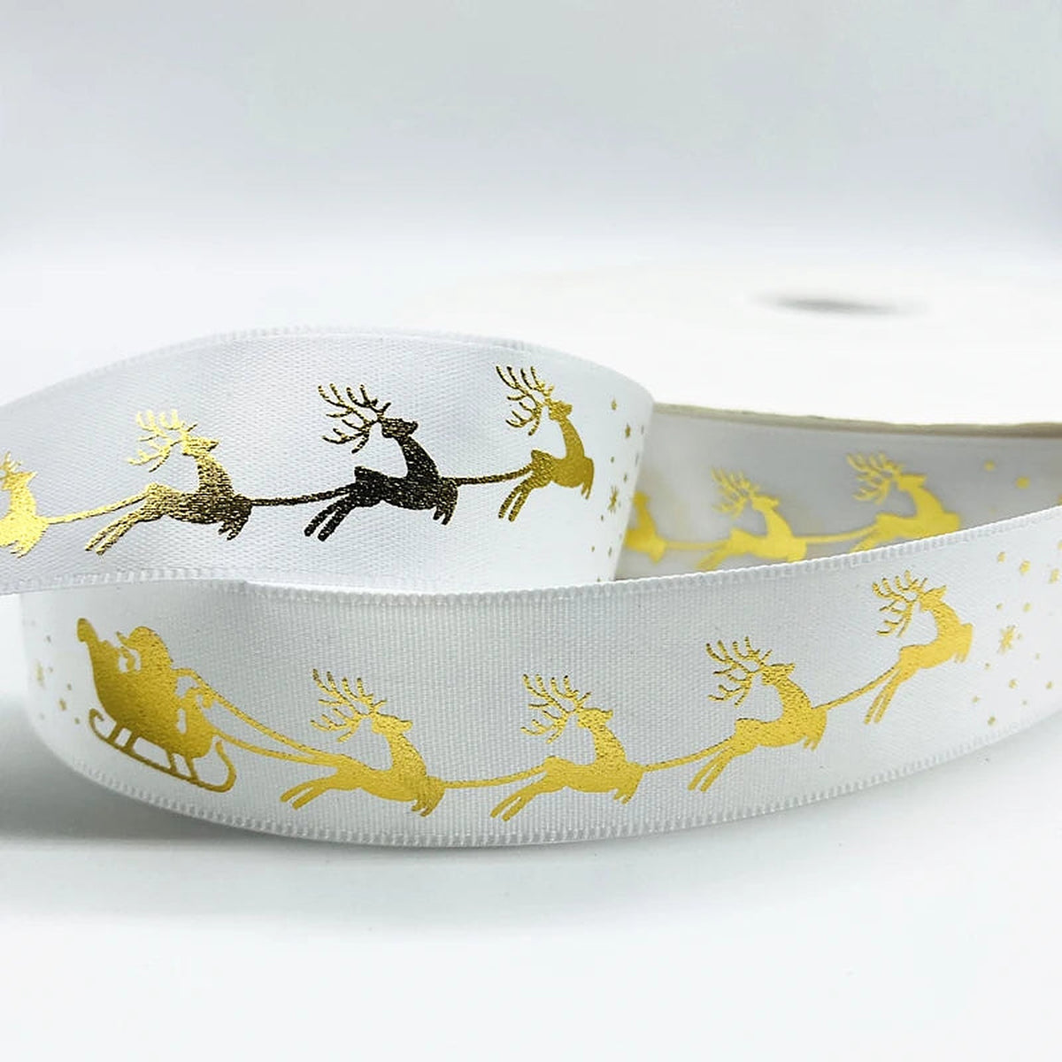 White ribbon with gold sleigh and reindeer
