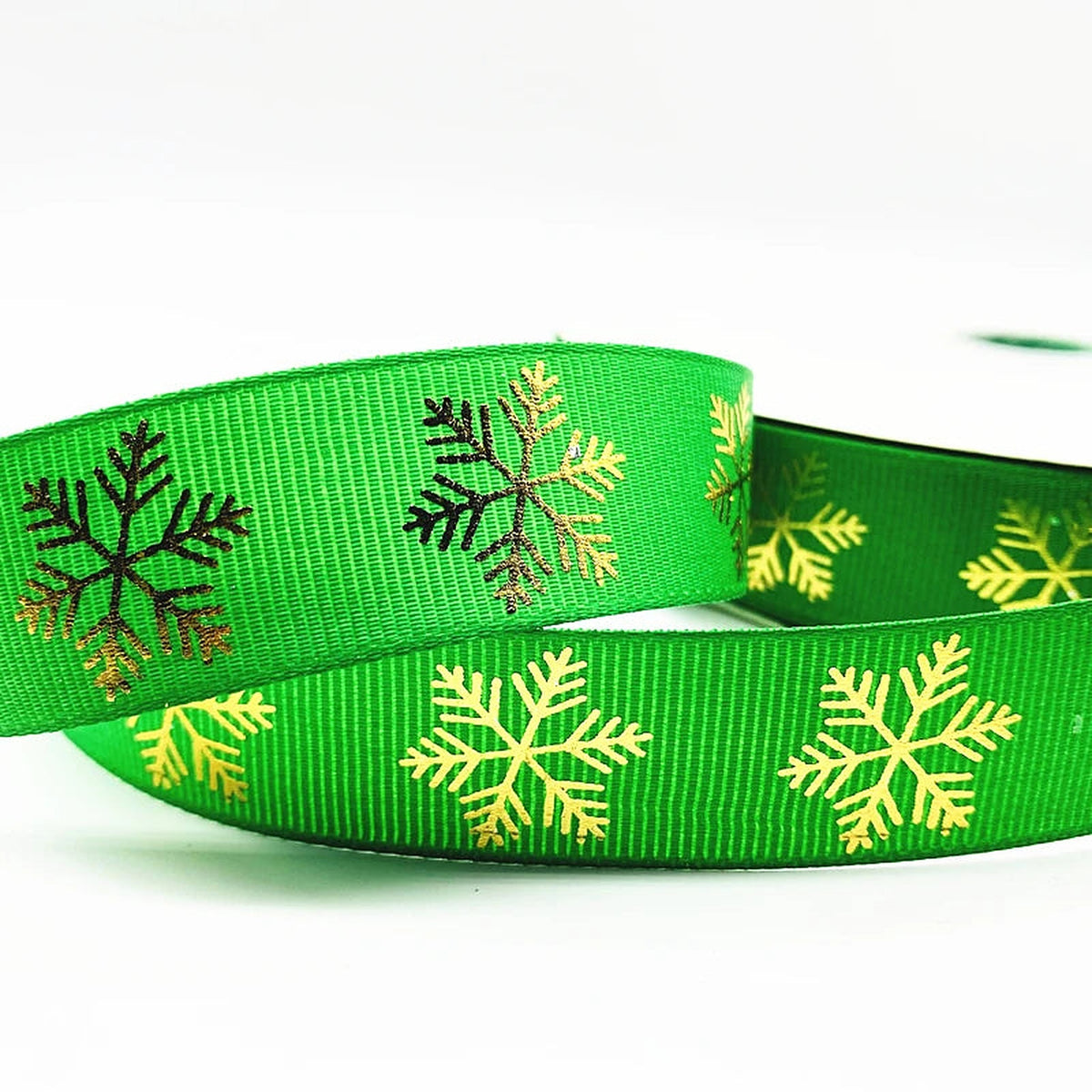 Bright green grosgrain ribbon with gold snowflakes